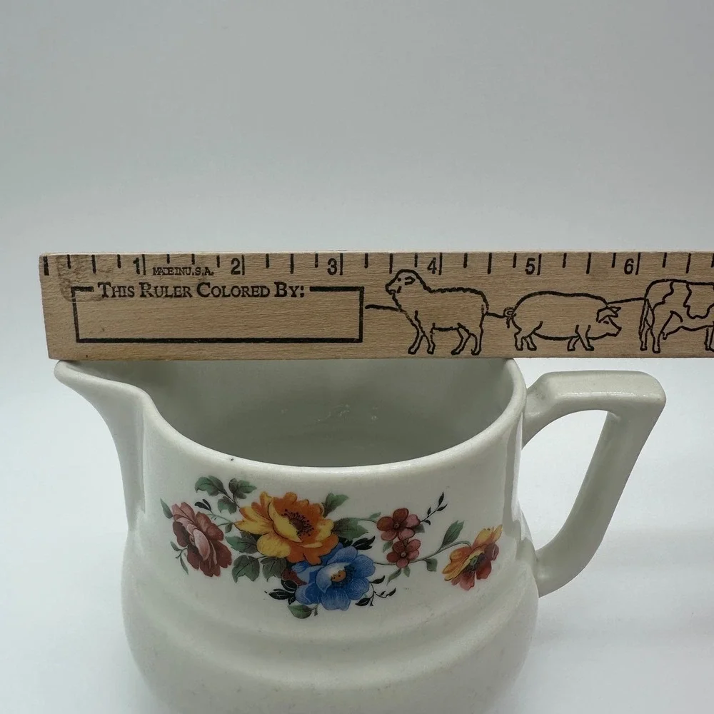 Drip-O-lator creamer spout